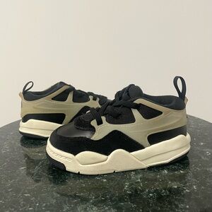 Jordan 4 RM Baby/Toddler shoes in a black and coconut milk colorway
